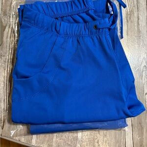 XS healing hands worms scrub pants 2 pair never worn.